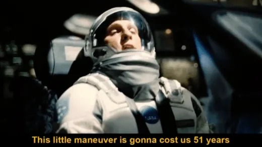 Matthew McConaughey as Cooper in a spacesuit in the cockpit, looking worried, with a subtitle
