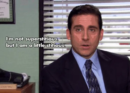 Michael Scott talking to the camera in his office, with a subtitle