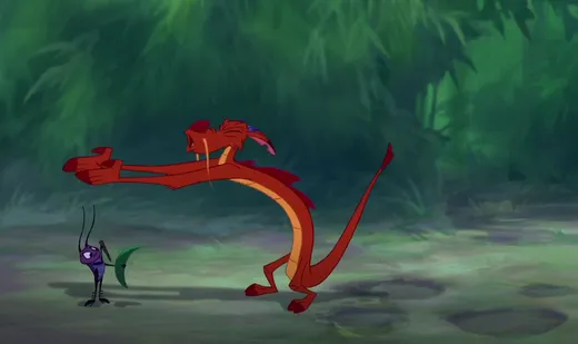 Mushu, a small red dragon, pointing dramatically
