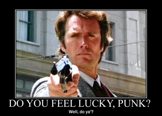 Clint Eastwood aiming a large revolver straight at the camera