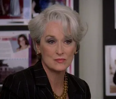 Miranda Priestly with silver hair, looking unimpressed