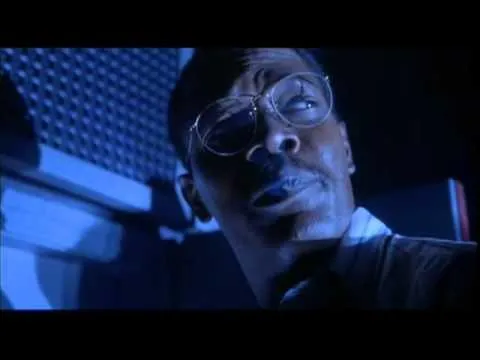 Samuel L. Jackson at a computer, cigarette in mouth, looking tense
