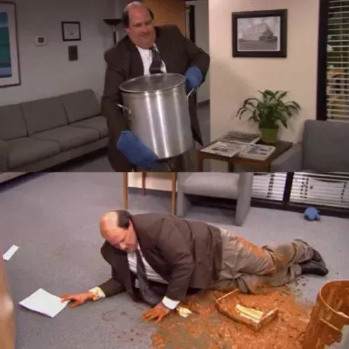 Kevin Malone kneeling on the office carpet in a puddle of spilled chili