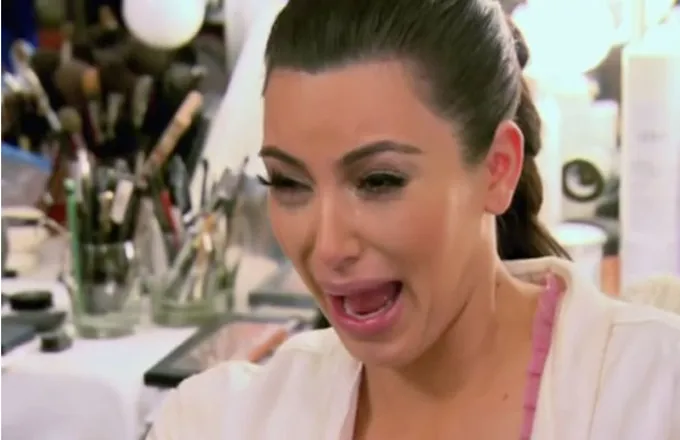Kim Kardashian crying with a distorted, tearful face