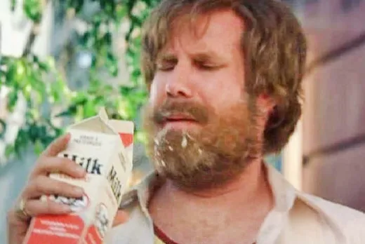 Ron Burgundy sweating in a phone booth, looking ill
