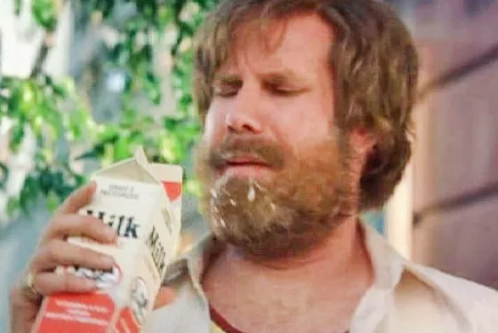 Ron Burgundy sweating in a phone booth, looking ill