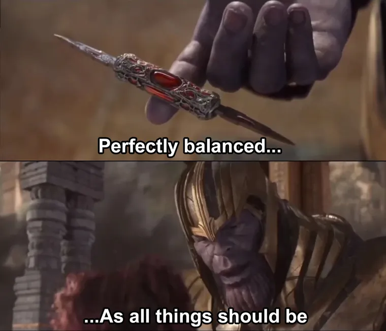 Thanos holding a double-bladed knife balanced on one finger