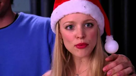 Regina George in a Santa hat looking annoyed