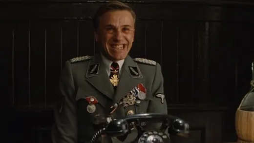Christoph Waltz as Hans Landa in an SS uniform, smiling