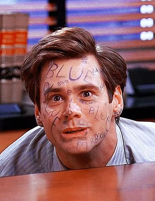 Jim Carrey as a lawyer in a suit, straining with an intense expression