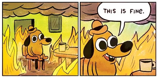 A cartoon dog in a hat sitting at a table in a burning room, saying This is fine