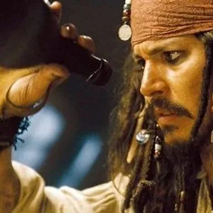 Jack Sparrow on a beach, gesturing in disbelief