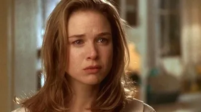 Renée Zellweger as Dorothy, tearful and smiling