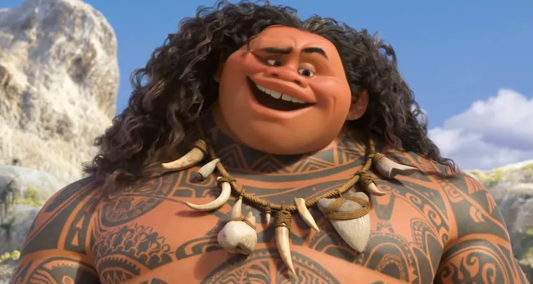 Maui, a large tattooed demigod with long curly hair, grinning